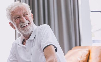 Patient in San Antonio talking to dentist about dentures